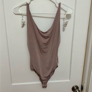 Mauve spandex body suit